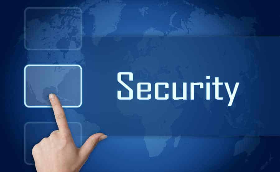 A hand touching a computer network interface with the word "security" highlighted on a world map background.